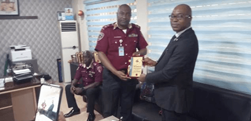 The GM CLRD, Mr. Shonde Gideon Oludotun receiving a Plaque from the Sector Commander, FRSC, Lagos State.