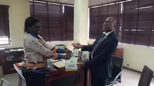 Mr Shonde presenting a Corporate Souvenir to LIRS director.