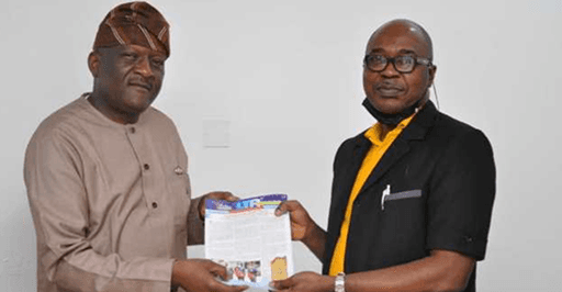 Mr. Tayo Akanle, GM Lagos Traffic Radio, presents the station’s bulletin to Mr. Shonde Gideon Oludotun.