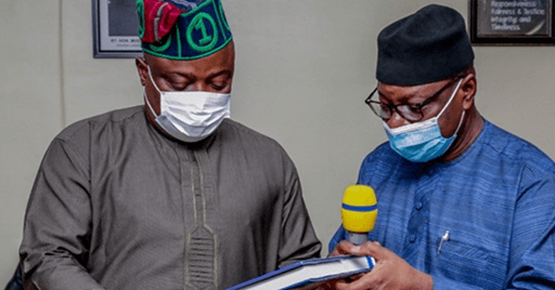 Dr. Ismail Adebayo Adewusi presents the Compendium of Nigerian Postage Stamps to Rt. Hon. Speaker Mudashiru Obasa.